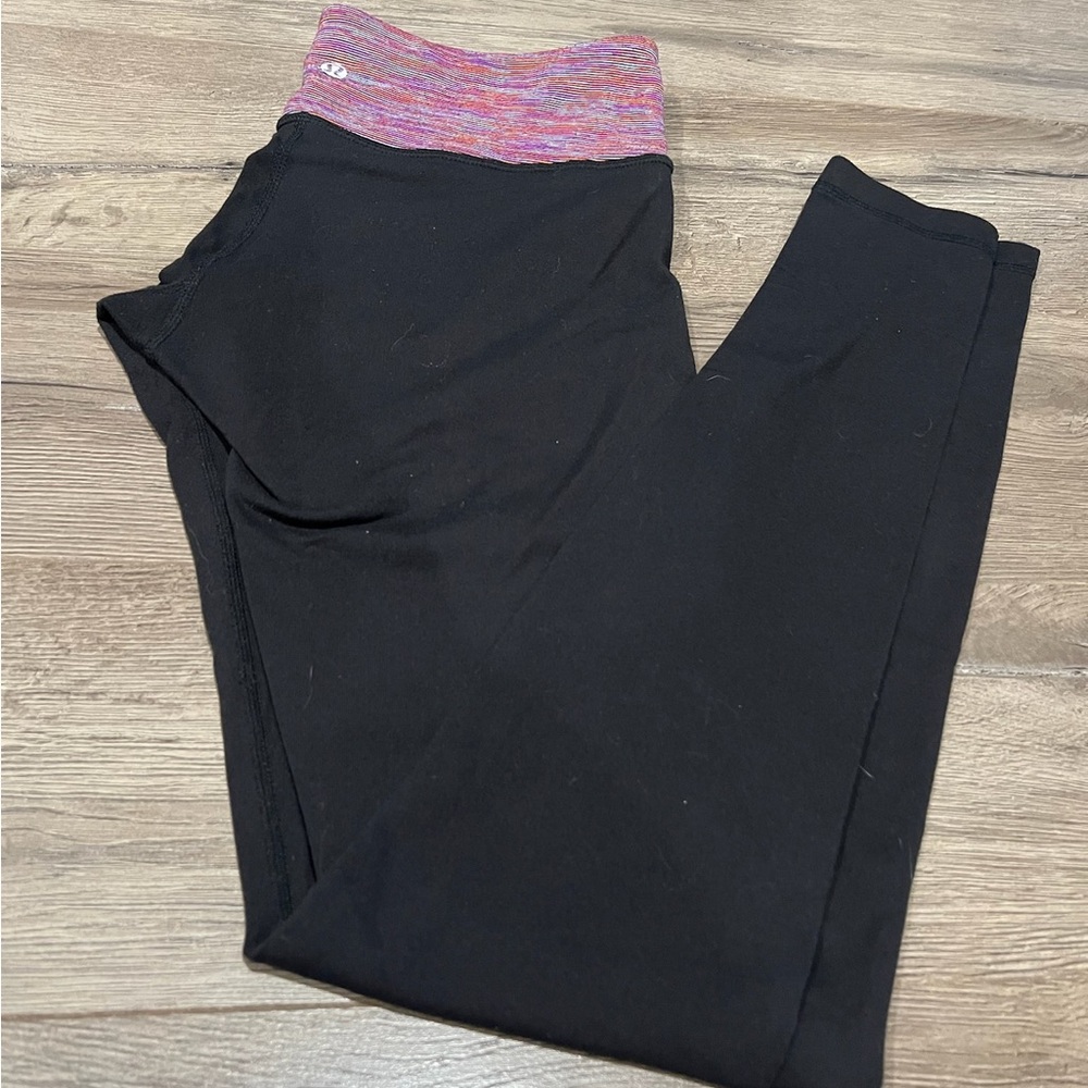 Lululemon Woman’s leggings. Black and orange. Size 6.